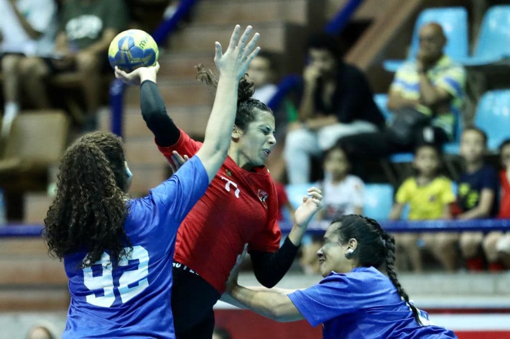 May be an image of 3 people, people standing, people playing sports and indoor