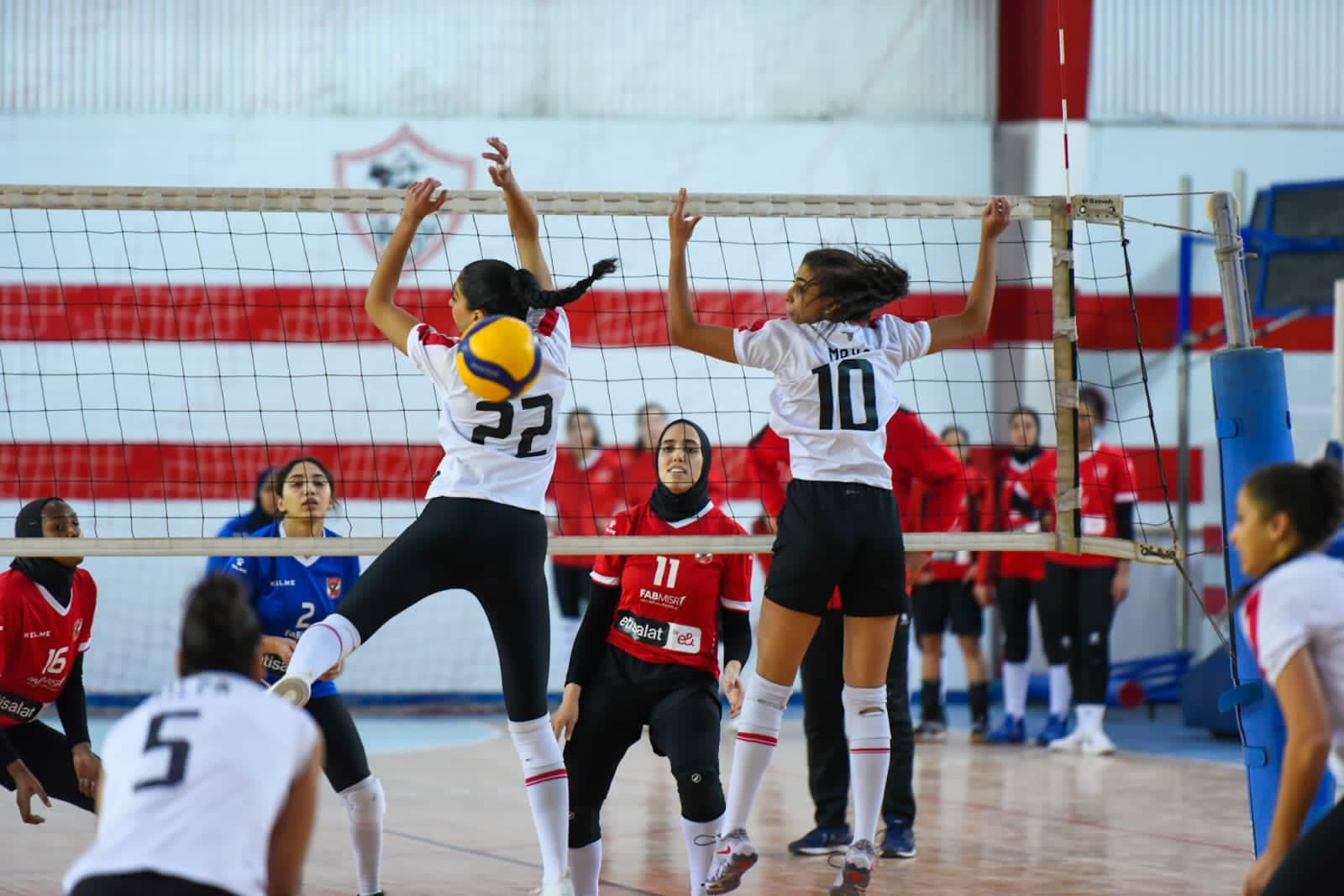 May be an image of 8 people, people playing voleyball and indoor
