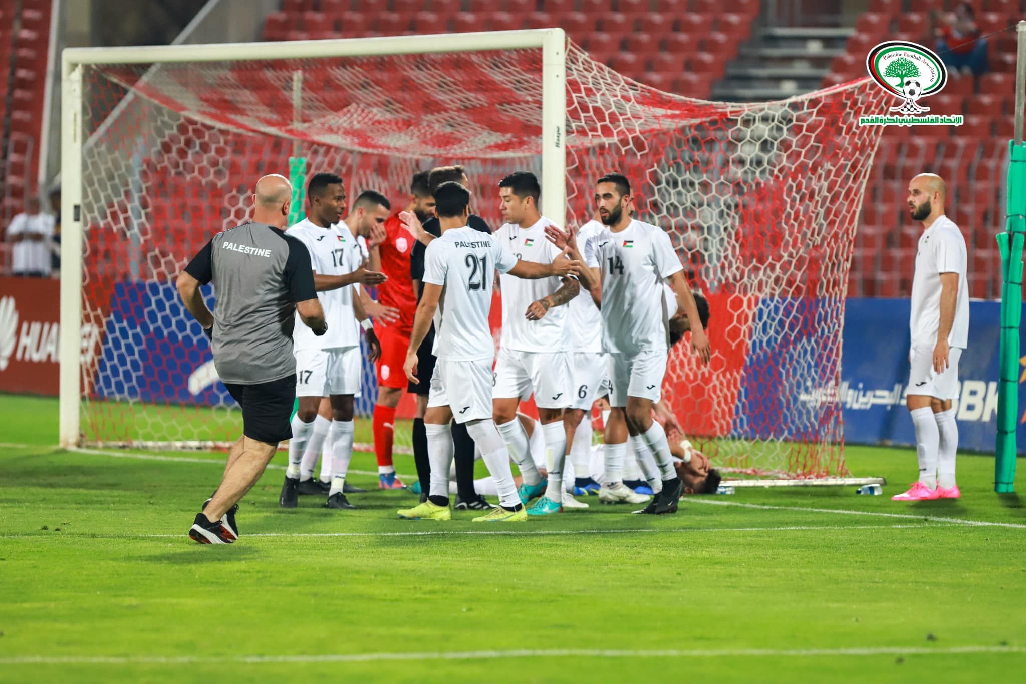 May be an image of 8 people, people standing, people playing sports and grass