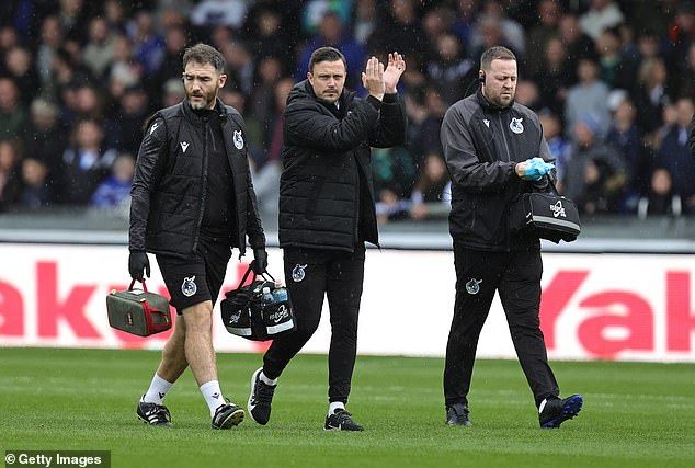 Stockport County coach Andy Mangan (centre) is set to join Real Madrid's backroom staff