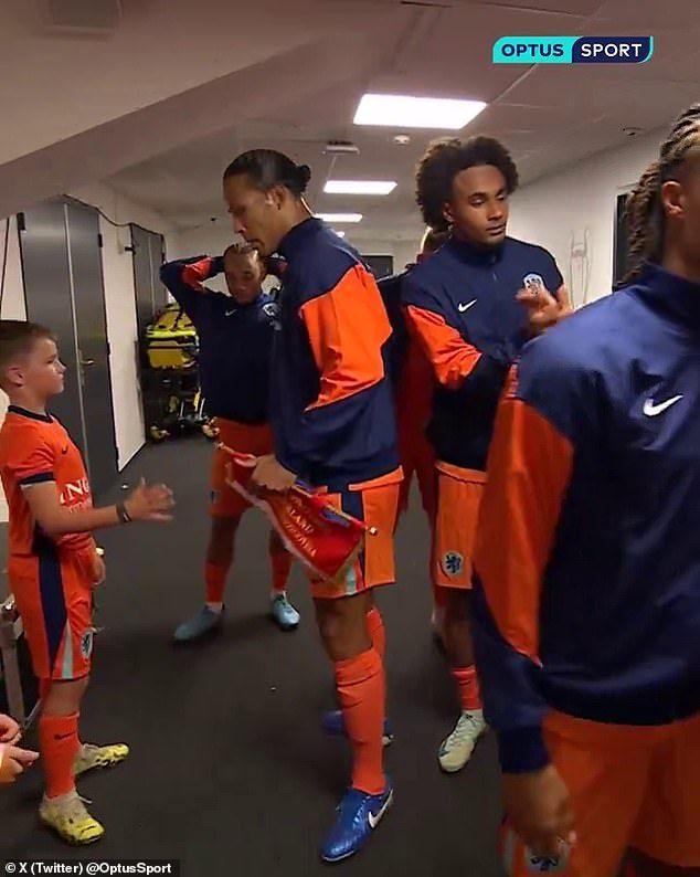 Liverpool's Virgil van Dijk (L) appeared to snub Man United's Joshua Zirkzee (R) on Dutch duty