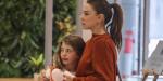 Kate Ritchie cuddles her mini-me daughter Mae, nine, while strolling through Sydney Airport... after her stalker nightmare was revealed