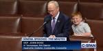 Republican Congressman John Rose's son steals the limelight by making silly faces behind him during his speech on the House floor