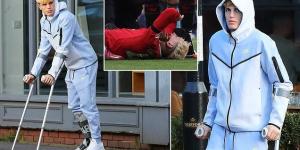Injured Manchester United star Alejandro Garnacho is spotted on crutches and wearing a moon boot after leaving a family lunch in Hale Village... as Argentine winger continues his recovery from ankle problem 