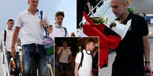 Manchester City touch down in Istanbul and check into their hotel ahead of Champions League final as Pep Guardiola is gifted a bouquet of flowers with his stars wearing matching white polo shirts and jeans