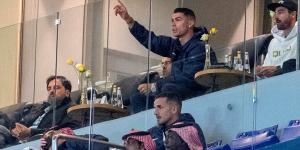 Cristiano Ronaldo salutes fans as he watches Al-Nassr's 4-4 draw with Al-Hazm from the stands while serving one-game ban for 'obscene gesture'... but his celebrations are cut short by 99th minute equaliser