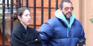 Adam Sandler bundles up in a blue padded jacket as he steps out for a leisurely stroll in London with daughter Sadie