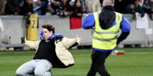 Football 'fan' who invaded the pitch at Spurs training in Melbourne films himself in the act - and reveals what he shouted at Ange Postecoglou's stars