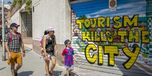 Now Barcelona joins Spain's war on tourists: Mayor pledges to drive AirBnb out of the city within five years after rents spiralled for locals