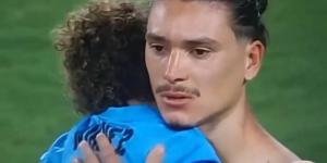 Darwin Nunez consoles his son in emotional scenes after Liverpool star threw chairs and battled Colombia fans when they 'attacked families of Uruguay players'