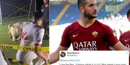 'White shorts was not the best idea!': Former Roma star Kostas Manolas goes viral as he is unveiled by new club Sharjah next to a LION - before fleeing to safety after the predator let out a huge roar just inches away from him