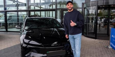 Kyle Walker picks up his new £48,700 BYD Seal after Lauryn Goodman was accused of purposefully fuelling public spat with him amid claims he missed their son's birthday