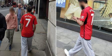 Disgust as football fan in No 7 Manchester United top with Hamas printed on the back parades through London as police launch hunt for man
