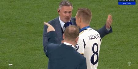 Awkward moment Jamie Carragher is told off during on-pitch interview with Toni Kroos as he congratulates the Real Madrid legend on winning the Champions League in his final game for the Spanish giants