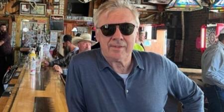 Real Madrid coach Carlo Ancelotti drinks in a saloon in Darby, Montana - a town with less than 1,000 people