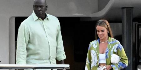 Michael Jordan and model wife Yvette Prieto step out for a romantic dinner in Barcelona as loved-up couple look stylish in coordinating outfits amid family vacation on $15m yacht