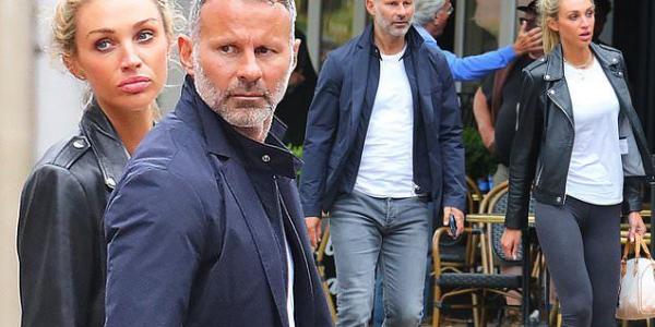 Ryan Giggs emerges with girlfriend Zara Charles as couple return from Portugal ... two weeks before his trial for alleged coercive behaviour and assault against ex Kate Greville