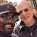 Joel and Avram Glazer arrive in London ahead of Man United's semi-final clash with Coventry as boxer Derek Chisora stops his 'old friend' for a selfie