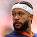 Memphis Depay showcases bizarre custom headband in the Netherlands' opening Euro 2024 win over Poland... with shocked fans insisting 'his aura is untouchable'