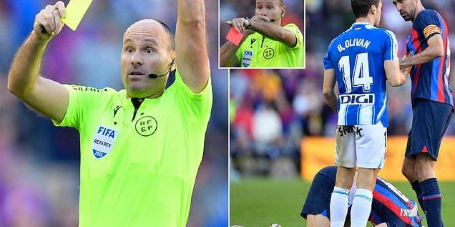 Unpopular referee Antonio Mateu Lahoz hands out FIFTEEN yellows and TWO red cards in Barcelona's 1-1 derby draw with Espanyol... in his first game since he also showed 15 bookings in Argentina's ill-tempered World Cup clash with Holland