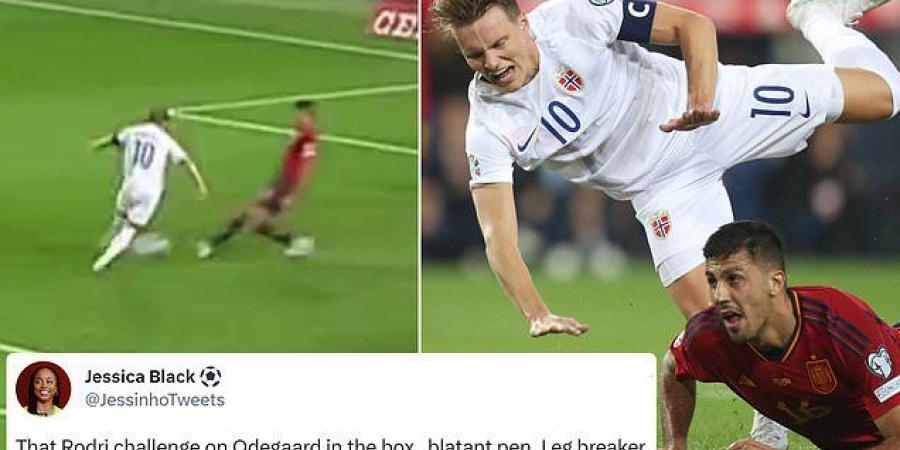 Arsenal fans fume as Martin Odegaard is left clutching his ankle after being wiped out with a 'leg breaking' tackle by Man City title rival Rodri... with the Gunners captain furious not to receive a penalty in Norway's defeat to Spain