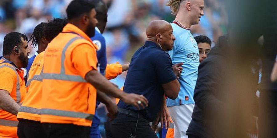 Manchester City players FLEE into the tunnel as fans surge onto the field moments after their 1-0 win over Chelsea sealed their title party... as rival supporters slam the 'forced' and 'embarrassing' pitch invasion 