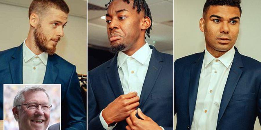 Man United stars show off their new  Paul Smith-designed blue suits for Saturday's FA Cup final clash with arch rivals Manchester City... after Sir Alex Ferguson took a swipe at Liverpool's infamous white outfits from 1996