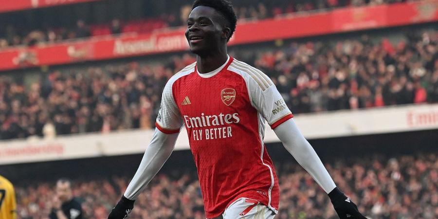 Arsenal 2-1 Wolves: Early strikes by Bukayo Saka and Martin Odegaard send the Gunners four points clear of Man City at Premier League summit but Matheus Cunha's strike ensured a nervy finale at the Emirates