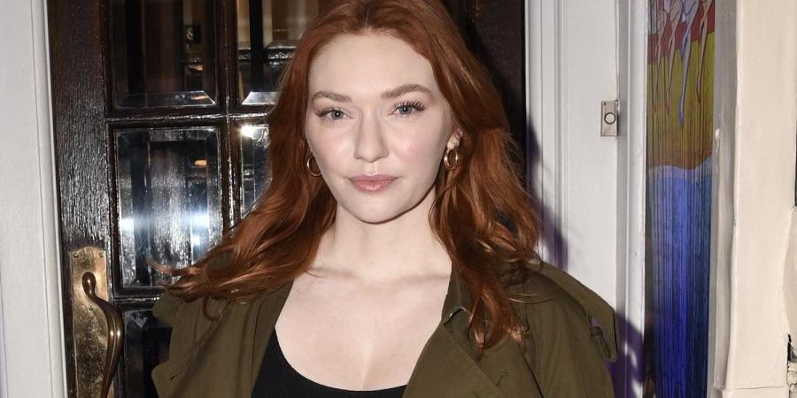 Eleanor Tomlinson flashes some cleavage in a low-cut vest top as she makes an appearance at The Hills Of California press night