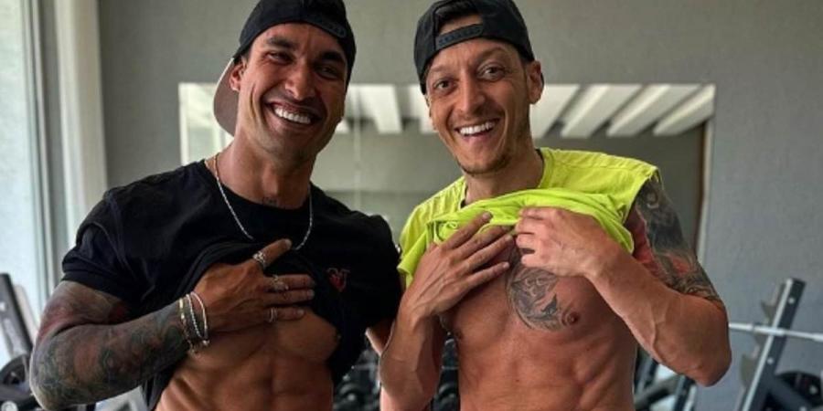 Mesut Ozil is trying to be a 'little Cristiano Ronaldo', former Germany team-mate claims amid body transformation... as he calls his new look 'crass'