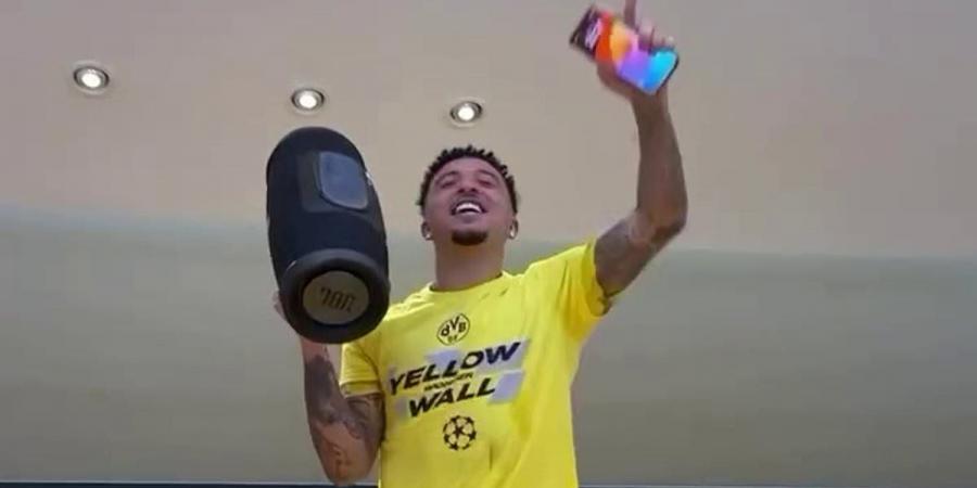 Jadon Sancho leads Borussia Dortmund's dressing room celebrations after beating PSG to reach Champions League final as Man United outcast belts out rendition of Adele hit
