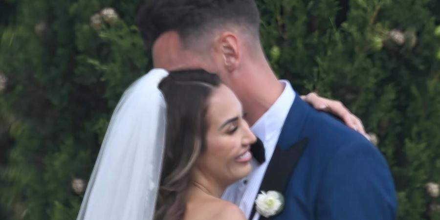 Chloe Goodman ties the knot as sister Lauryn is uninvited from the big day! Star 'left in floods of tears' over family feud - as she films new WAG reality show just five minutes away from her sister's wedding in Portugal