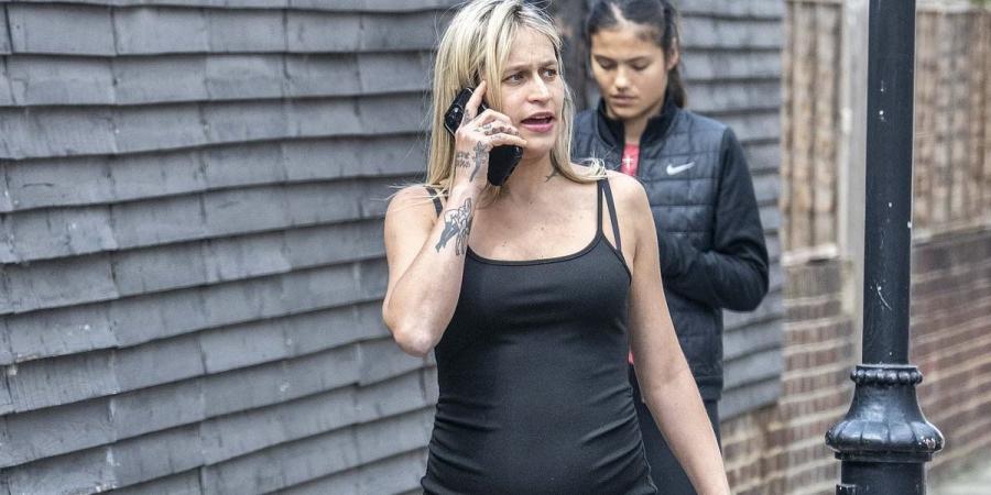 Pregnant Alice Dellal, 36, shows off her growing bump in a black dress as she's seen for the first time since revealing she's expecting her first child