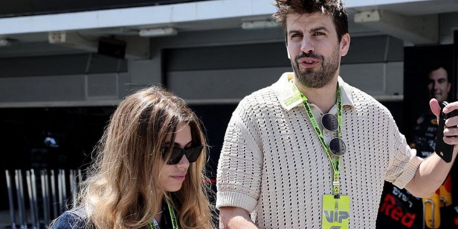 Gerard Pique, 37, packs on the PDA with girlfriend Clara Chia, 25, as they hold hands at the Spanish Grand Prix