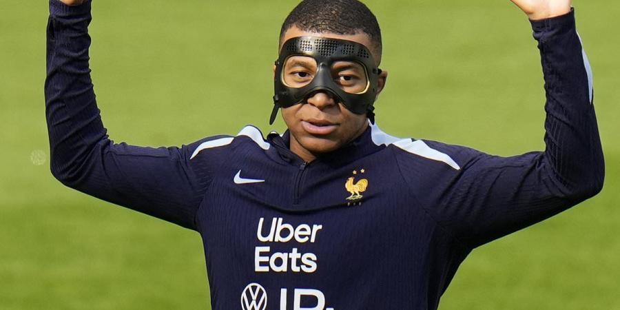 Kylian Mbappe is struggling with his new face mask, Didier Deschamps reveals - but the France boss insists the superstar is 'raring to go' after breaking his nose