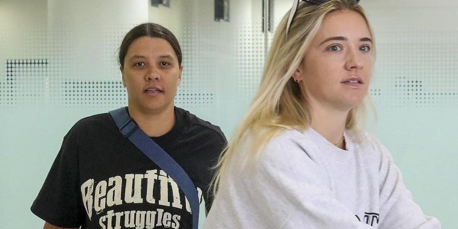 Sam Kerr and her fiancee Kristie Mewis touch down in Australia for the first time since she was charged with racially harassing a cop - hours after couple were dealt bad news