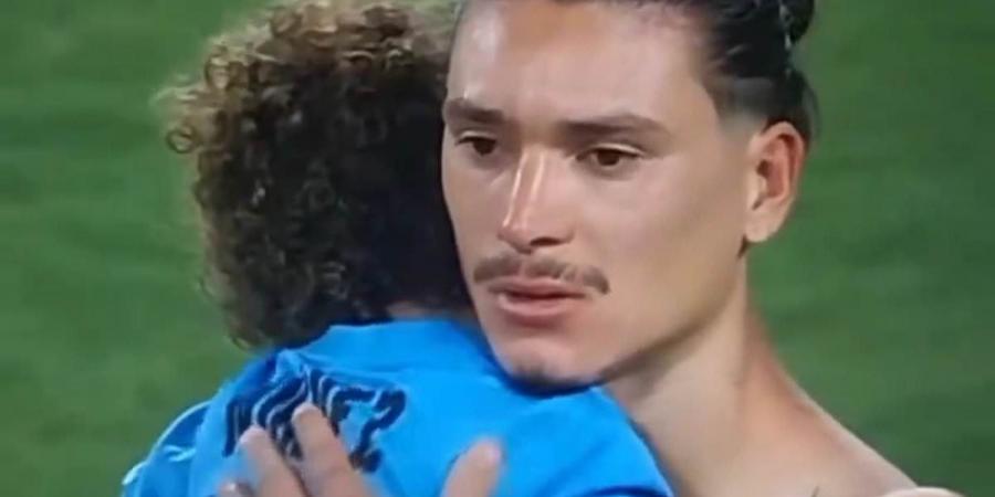 Darwin Nunez consoles his son in emotional scenes after Liverpool star threw chairs and battled Colombia fans when they 'attacked families of Uruguay players'