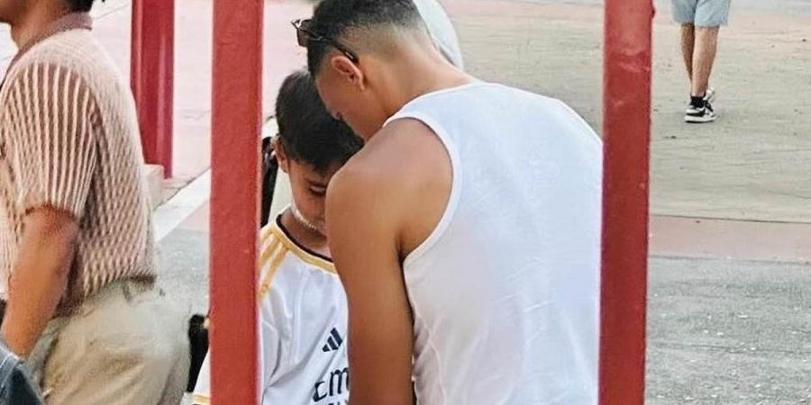 Trent Alexander-Arnold is spotted signing a young Real Madrid fan's shirt during holiday with Jude Bellingham adding to speculation about a move away from Liverpool