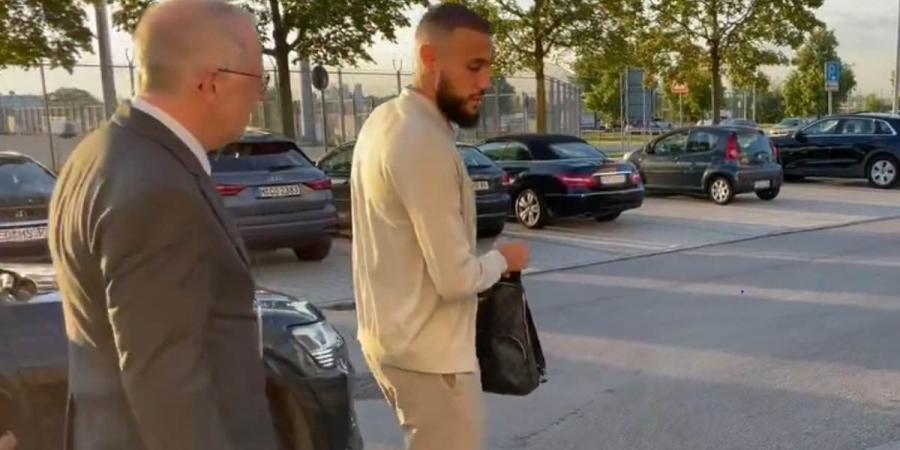 Matthijs de Ligt and Noussair Mazraoui arrive at Munich Airport ahead of completing their moves to Manchester United - as Red Devils prepare for £60m double swoop for defenders