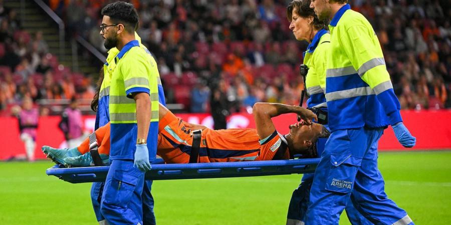 Man City defender Nathan Ake is taken off on a stretcher in tears after suffering serious injury in Netherlands' Nations League clash with Germany