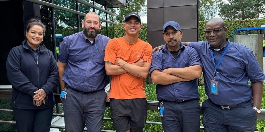 Thiago Silva poses with Chelsea staff and watches a training session on his return to Cobham - as the Brazilian thanks Blues fans for their 'continuous affection'